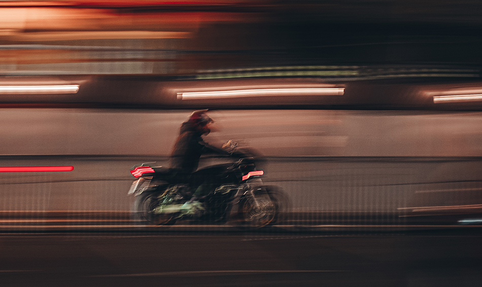 motorcycle traveling fast at night