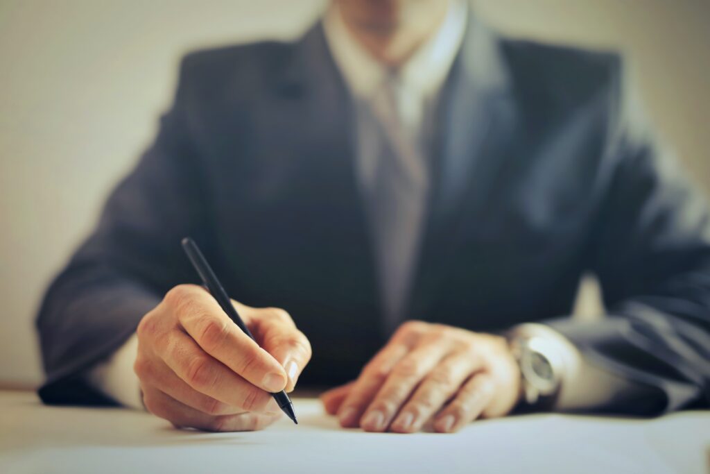 Lawyer writing at desk